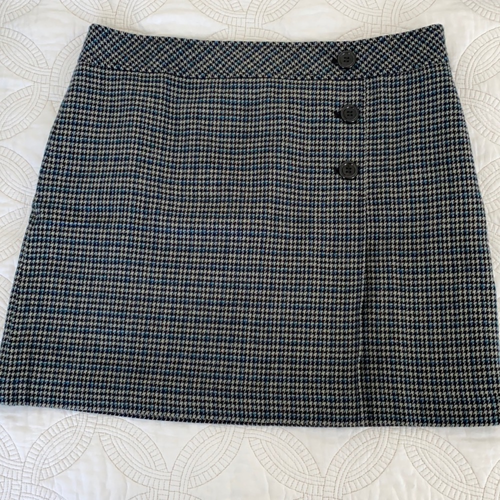 Get the look of wool without the itch! Cute Gray, Black and Blue plaid skirt.
